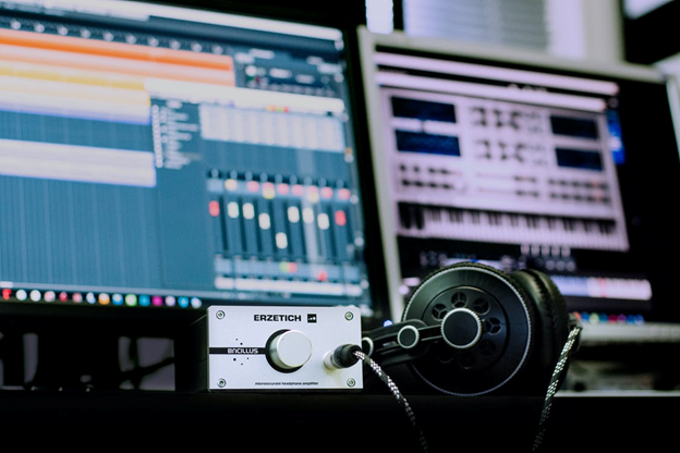 headphones lying on audio equipment in a recording studio